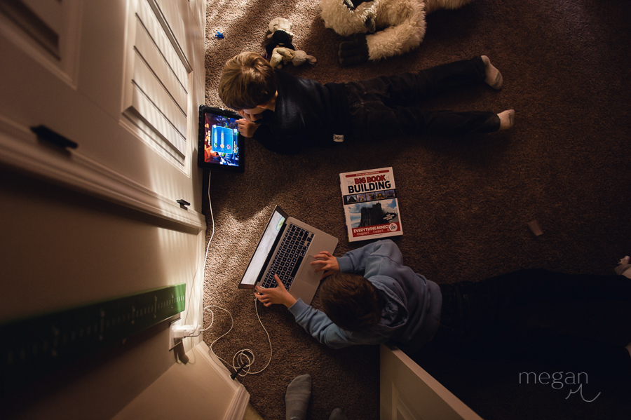 overhead shot of boys playing electronic games in natural light