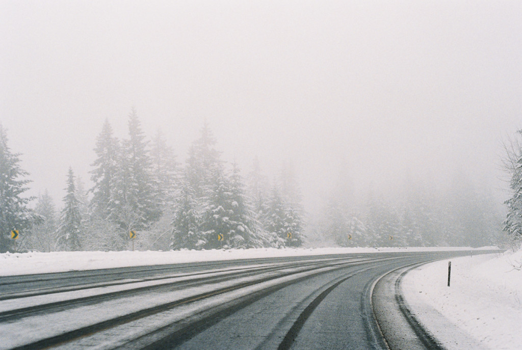 snowy road and trees on fuji super 800 film by megan cieloha