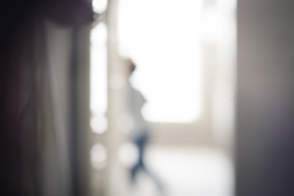 young boy runs in morning light photo purposefully out of focus by megan cieloha