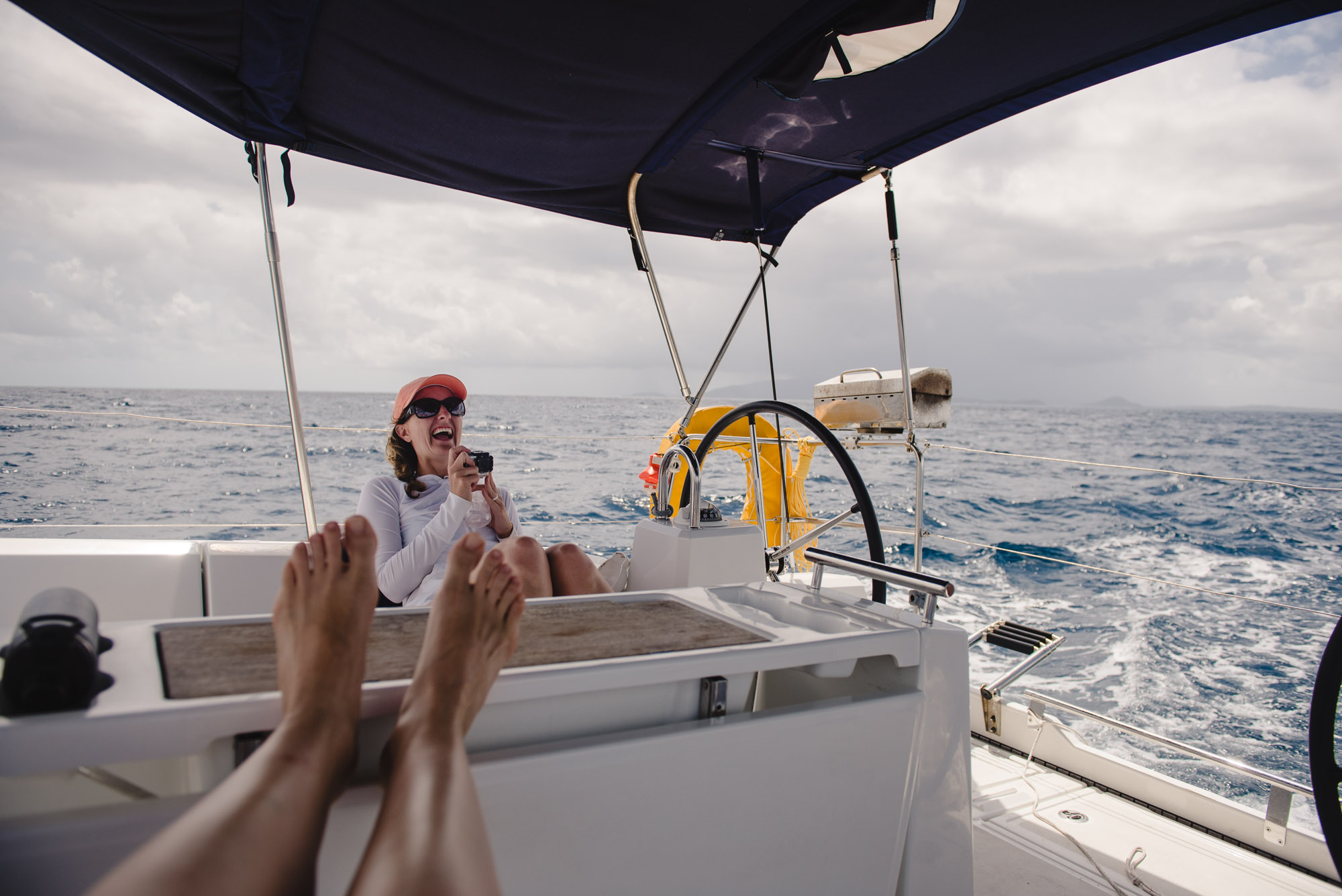 1pm, Open ocean under cloudy sky and boat awning, 24 mm, ISO 100, f/4.0, 1/3200