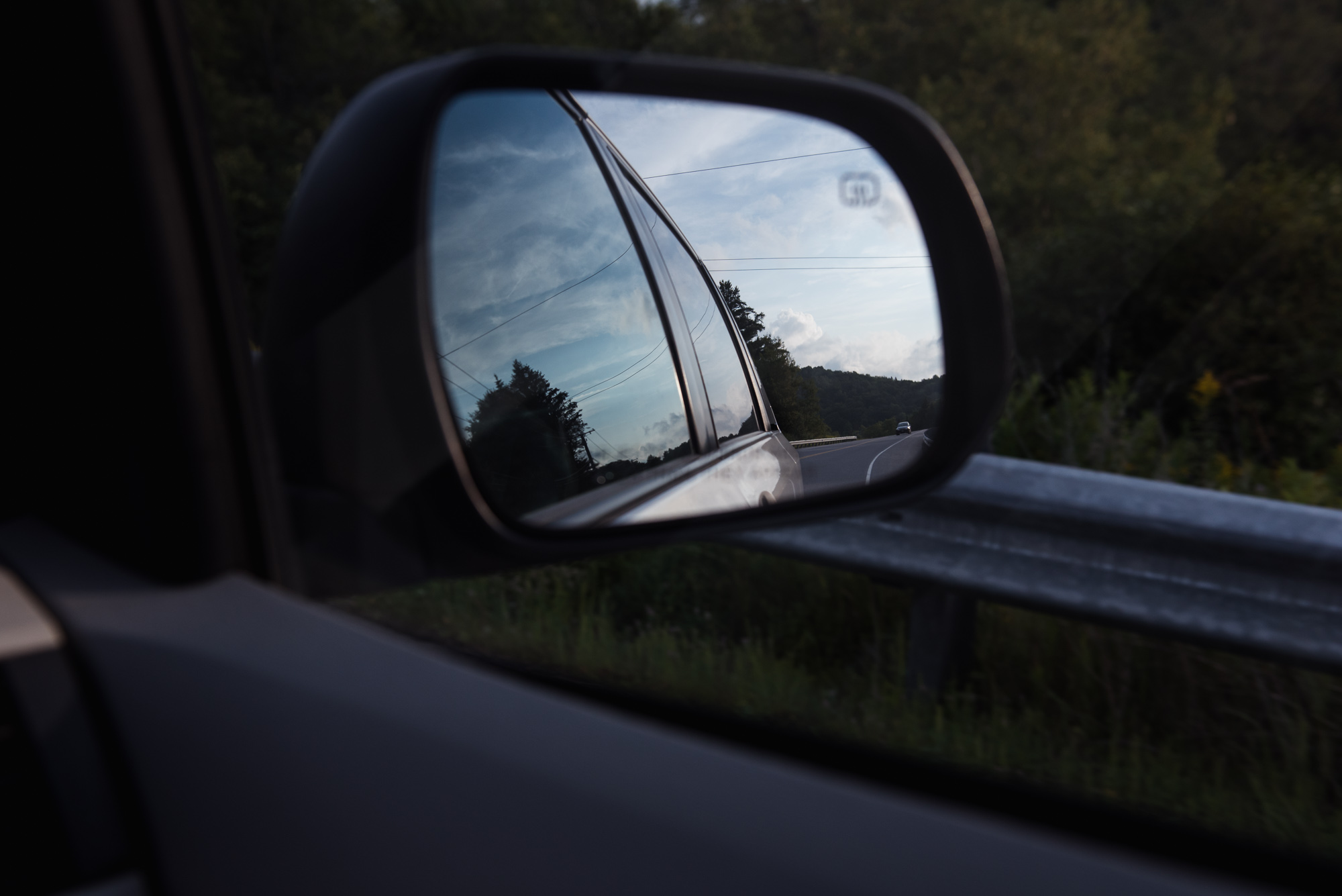 reflection of vermont road in side mirror  by megan cieloha